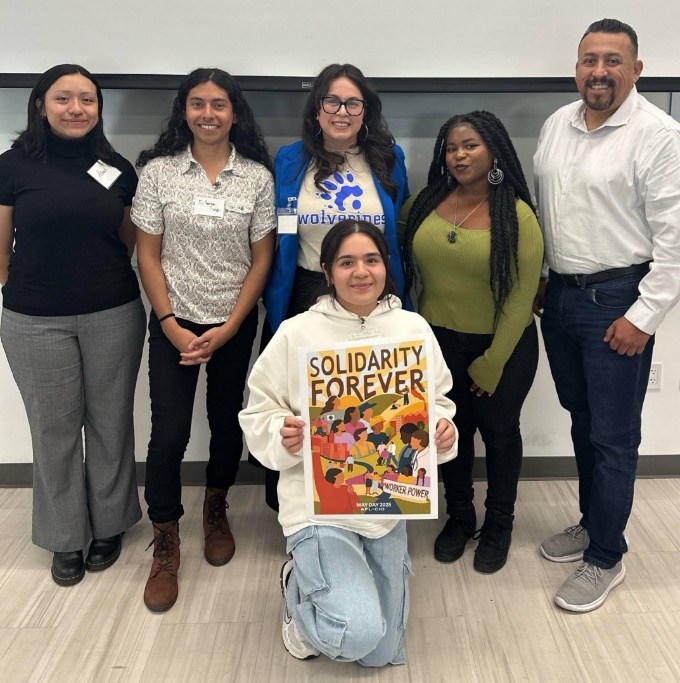 A group of people posing for a photo

AI-generated content may be incorrect.