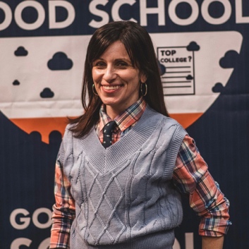 A person in a vest smiling

AI-generated content may be incorrect.