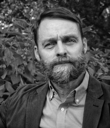 A person with a beard

AI-generated content may be incorrect.